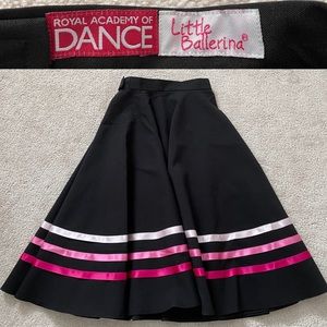 Gently used girls character skirt with pink ribbons.